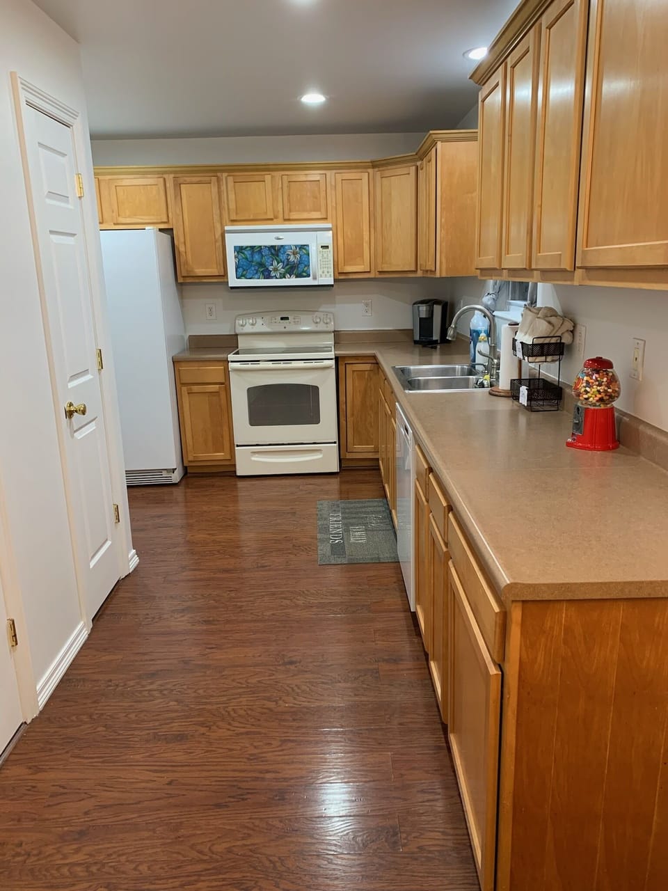 Kitchen has convection stovetop with Microwave hood and dishwasher.