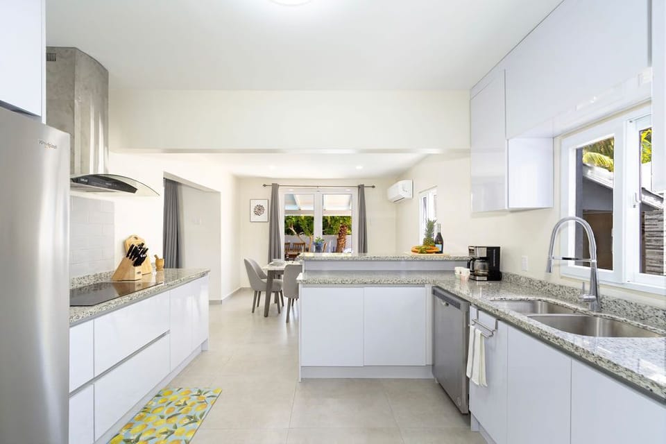 This home has a bar counter, fully equipped kitchen, a dining area that can serve 6 people and direct access to the outdoor space for more seating. Perfect for large group and families!