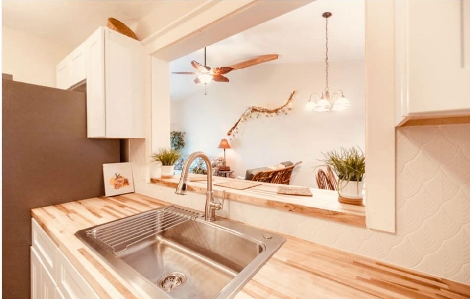 Fully stocked kitchen with breakfast counter.