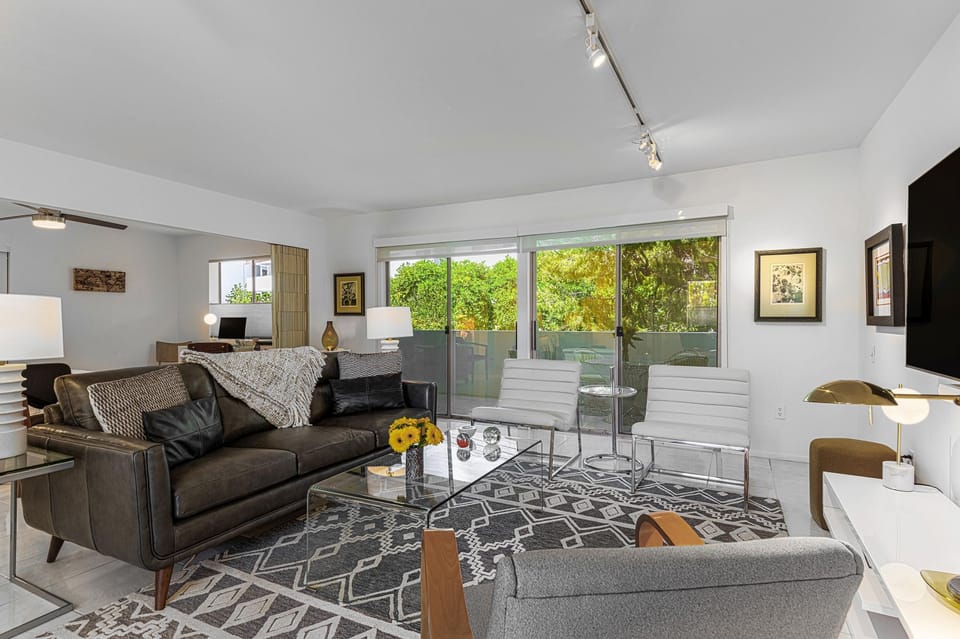 Living room shown with optional accordion wall open for maximum space