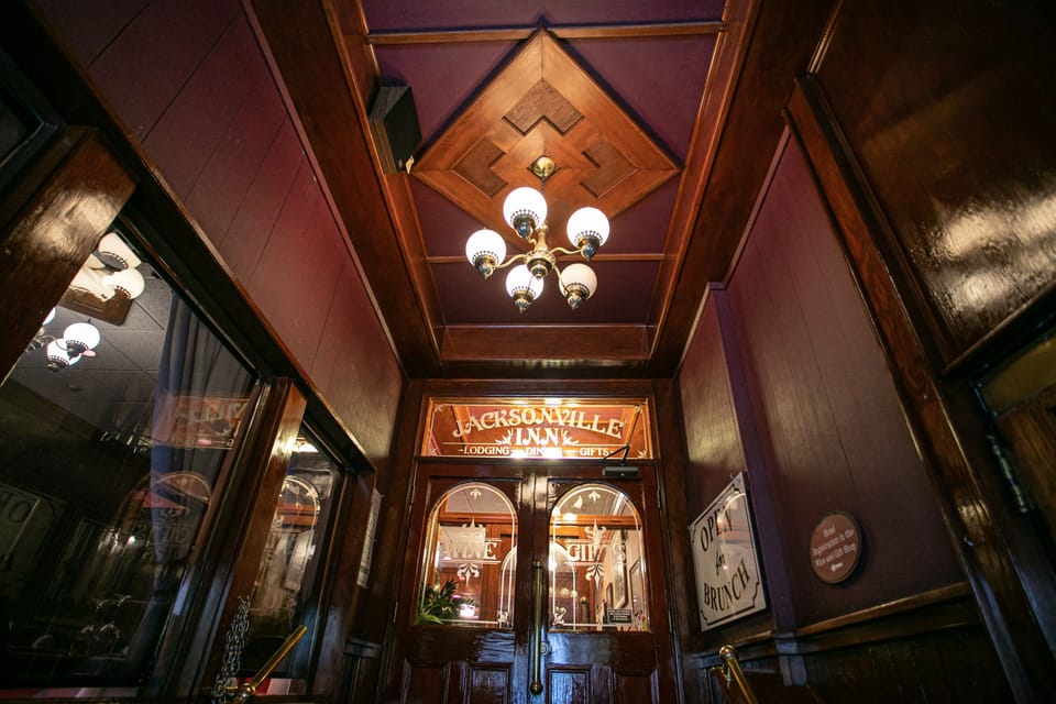 Welcoming Wine Bar entrance conveniently located on California Street, inviting you to unwind with exceptional wines and a cozy atmosphere.