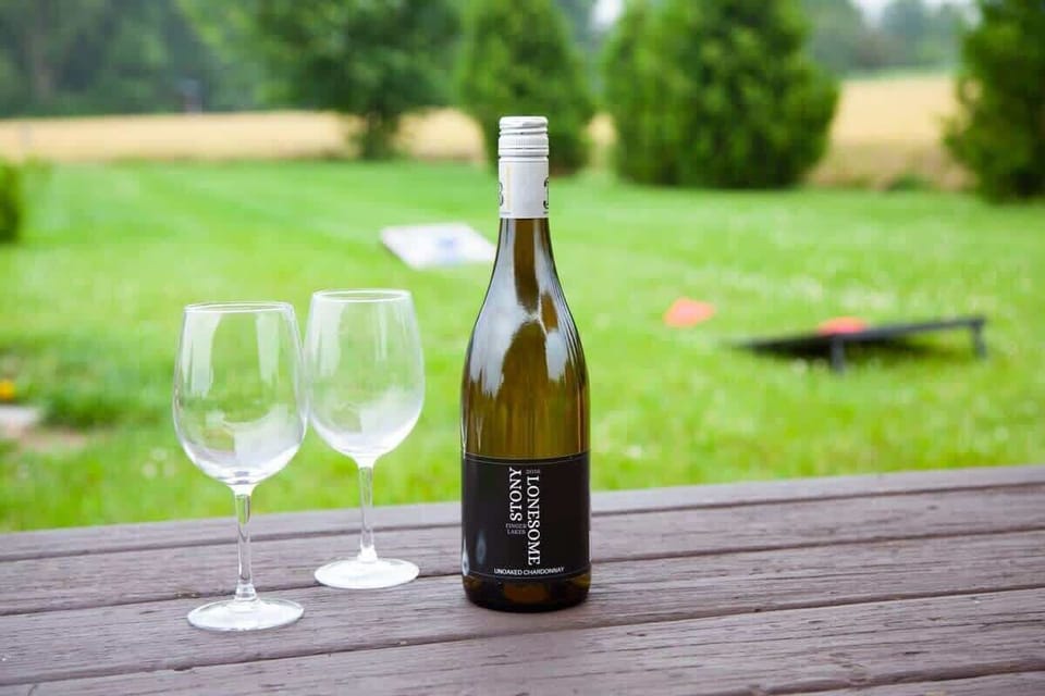 Wine, lawn games, and lakeside vibes.