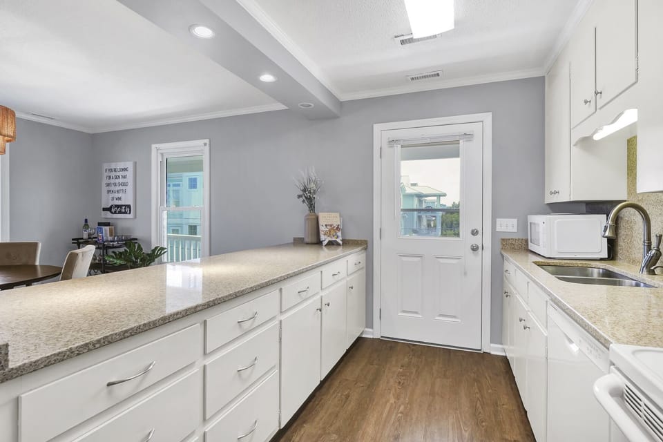 Well stocked galley style kitchen; Unit A