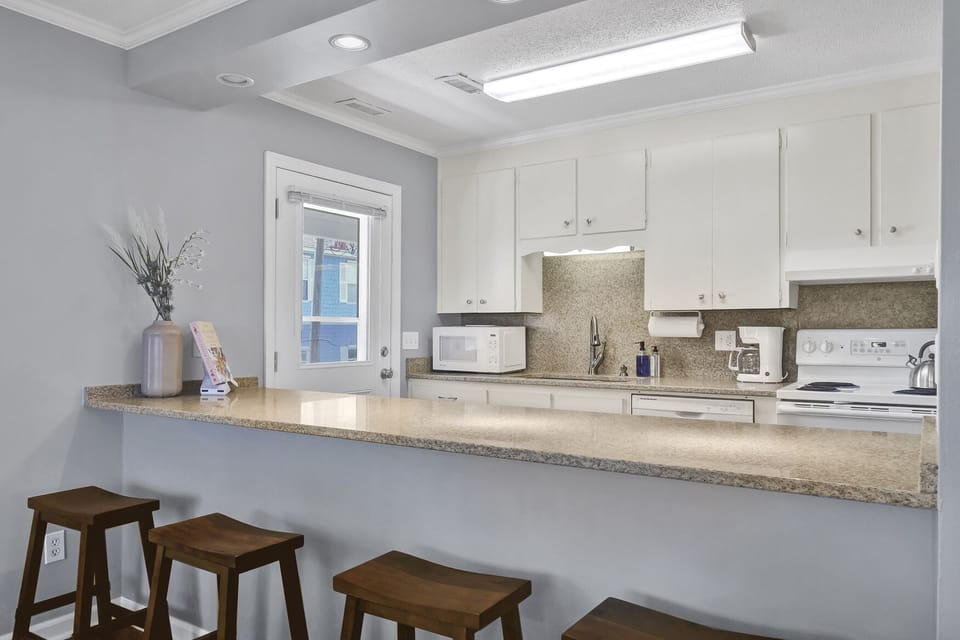 Additional bar seating so you can chat with the cook; Unit A