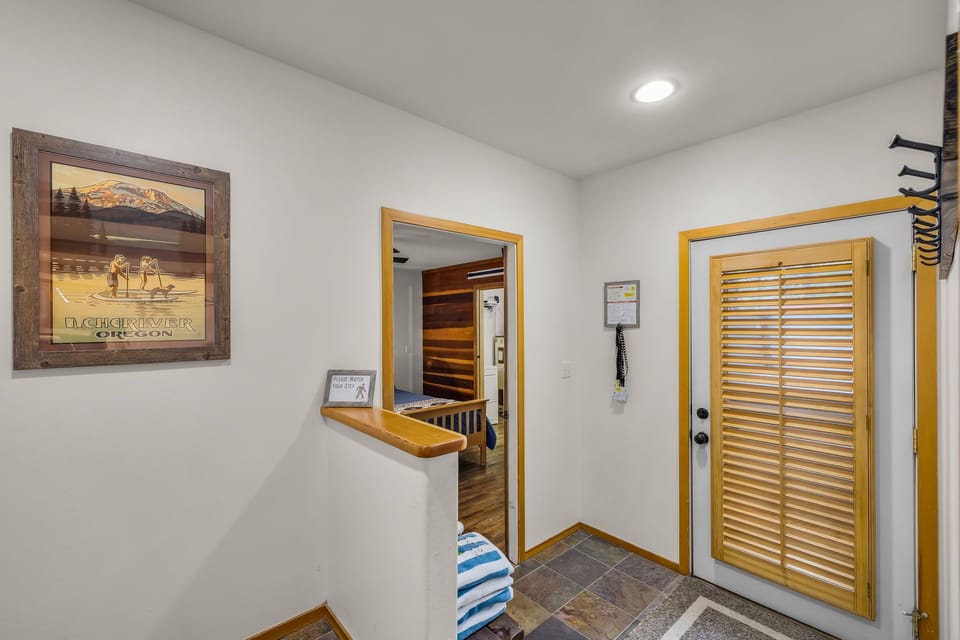 Step into your welcoming entrance with mountain-inspired artwork and natural wood touches that set the tone for your getaway.
