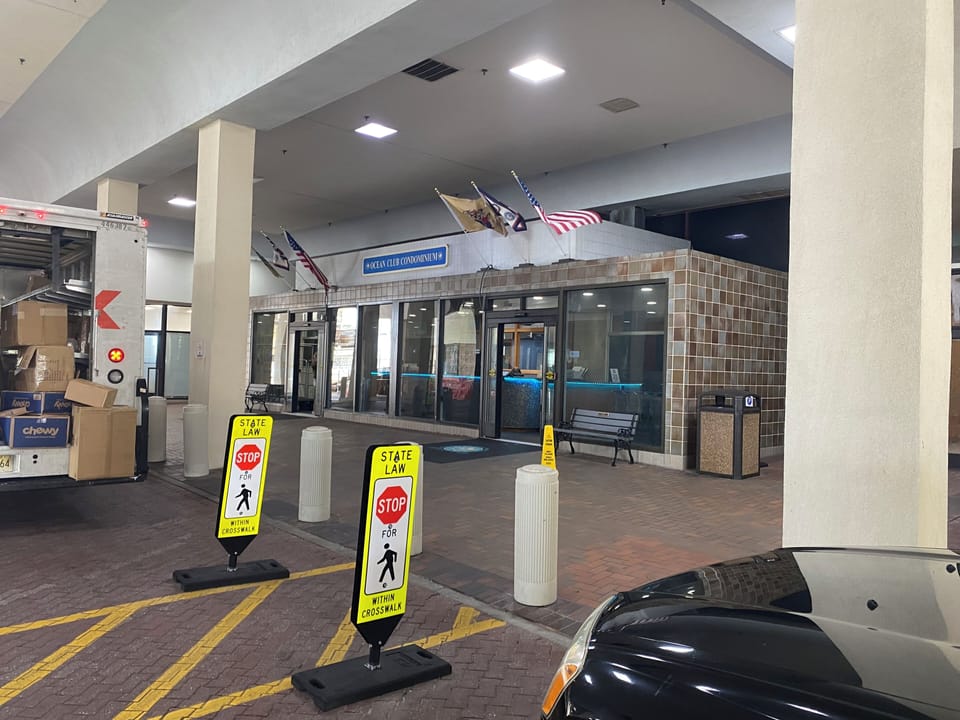 Main entrance, with security, where you pull up and unload your car