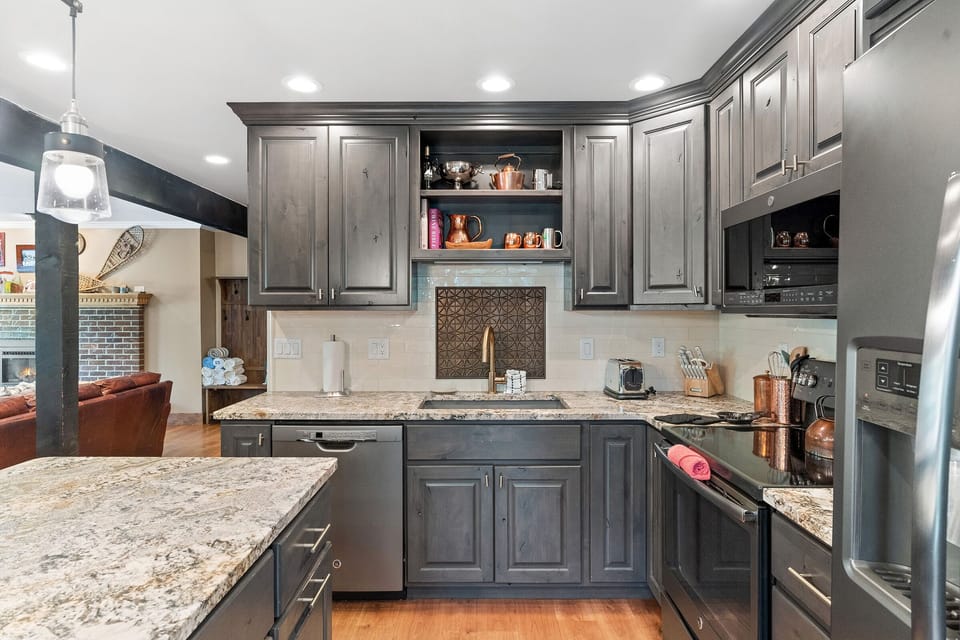 Dishwasher, stainless steel fridge, sink, oven.
