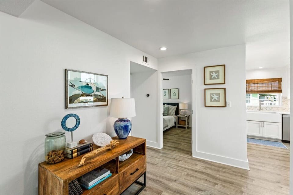 Entryway: Bright and welcoming with beachy decor and a seamless flow inside!