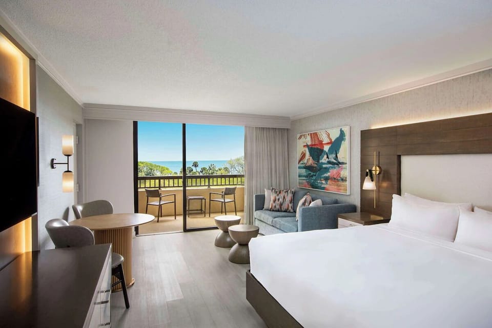Enjoy sunset drinks by the window with a sweeping ocean backdrop.
