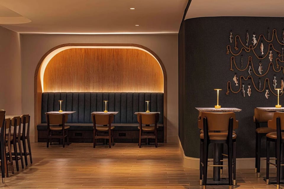 Unwind at the stylish lobby bar under sculptural lighting.