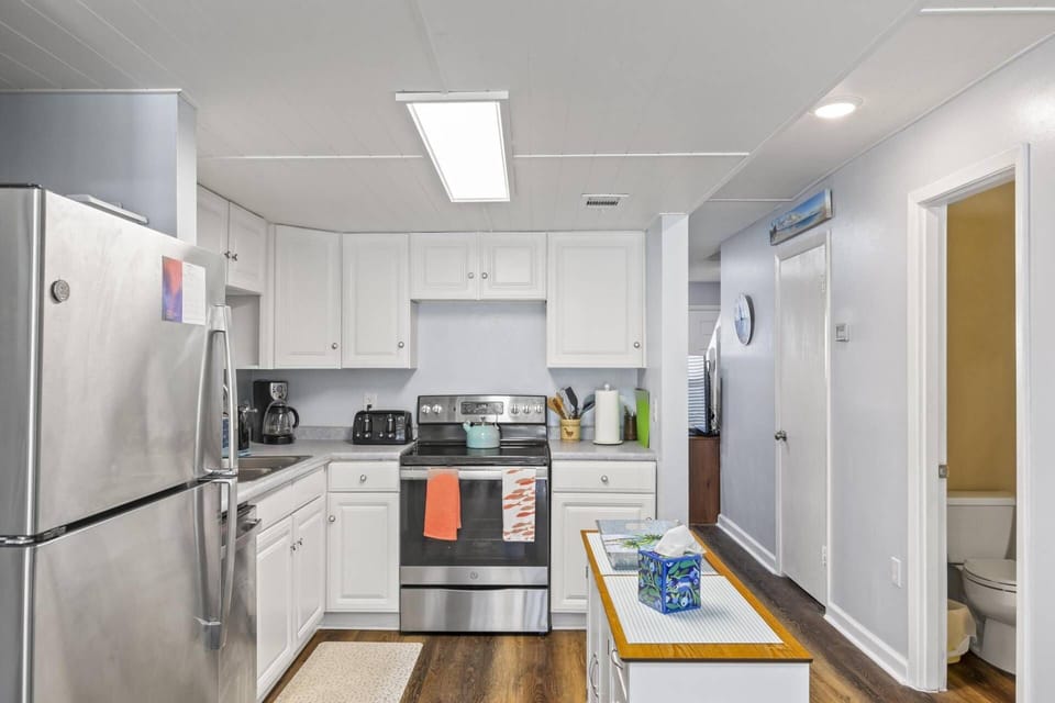 Kitchen With Half Bath In Hallway