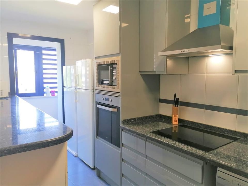 Fully fitted kitchen with laundry room to the rear