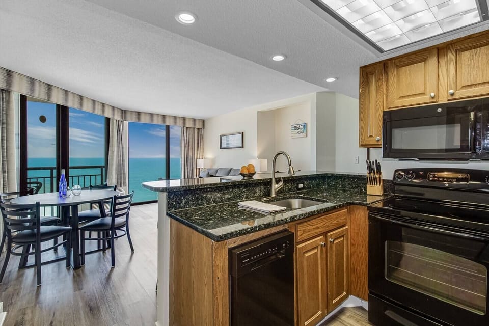 Discover the functional elegance of our kitchen, boasting sleek countertops, modern appliances, and a layout designed for efficiency.