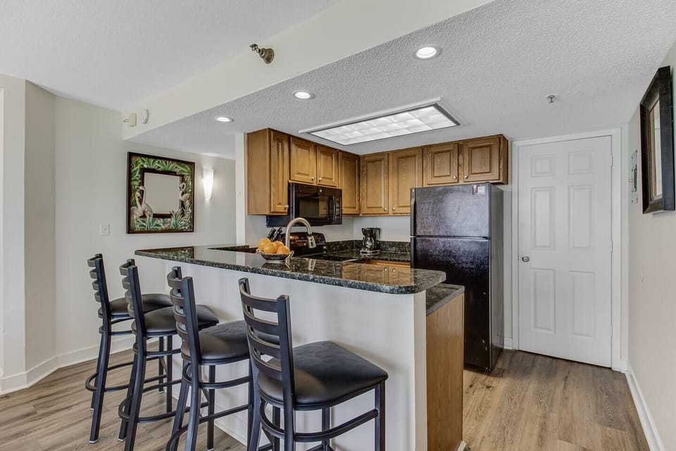 Immerse yourself in open-concept living, where the living area seamlessly transitions into the dining space, creating a spacious and welcoming environment for both relaxation and entertaining.