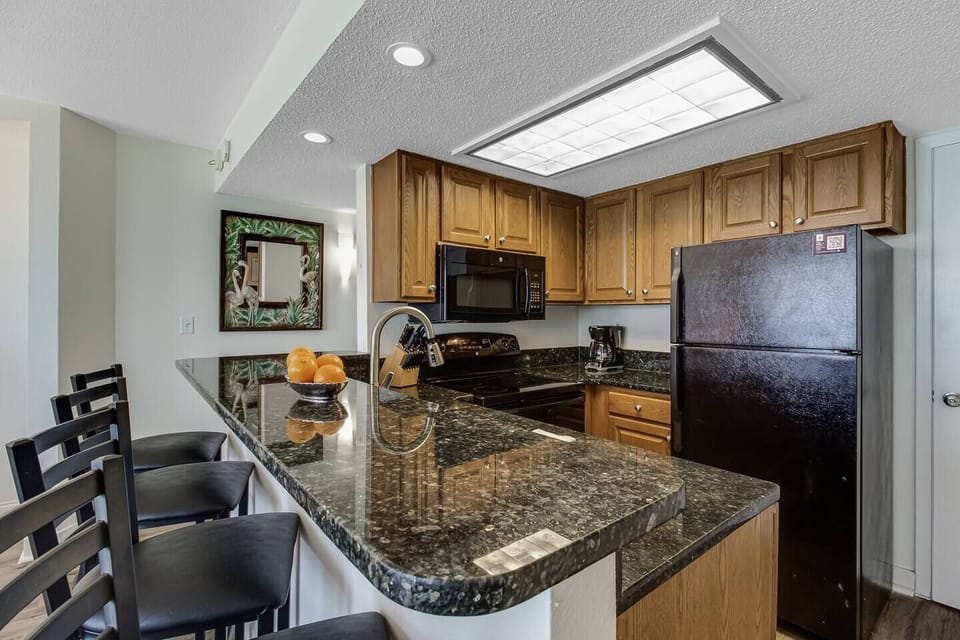 Discover the functional elegance of our kitchen, boasting sleek countertops, modern appliances, and a layout designed for efficiency.