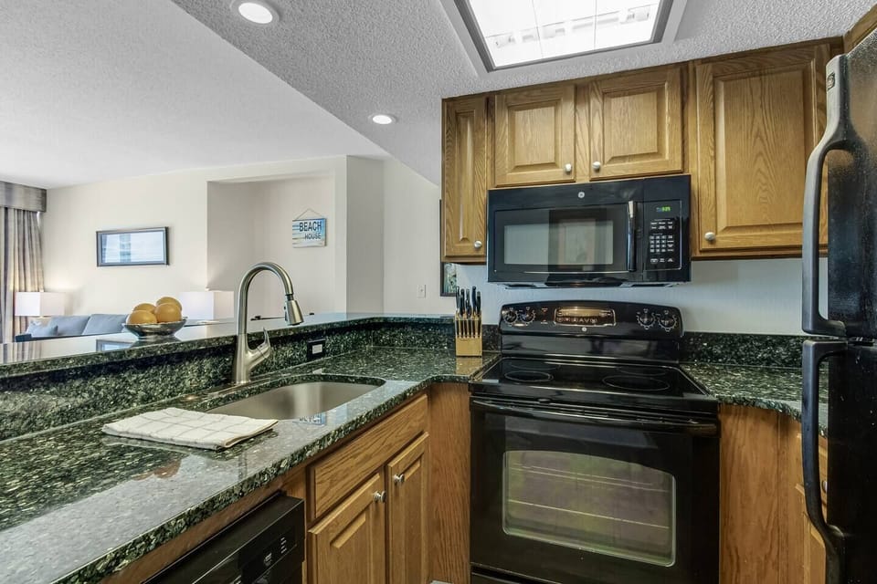 Discover the functional elegance of our kitchen, boasting sleek countertops, modern appliances, and a layout designed for efficiency.