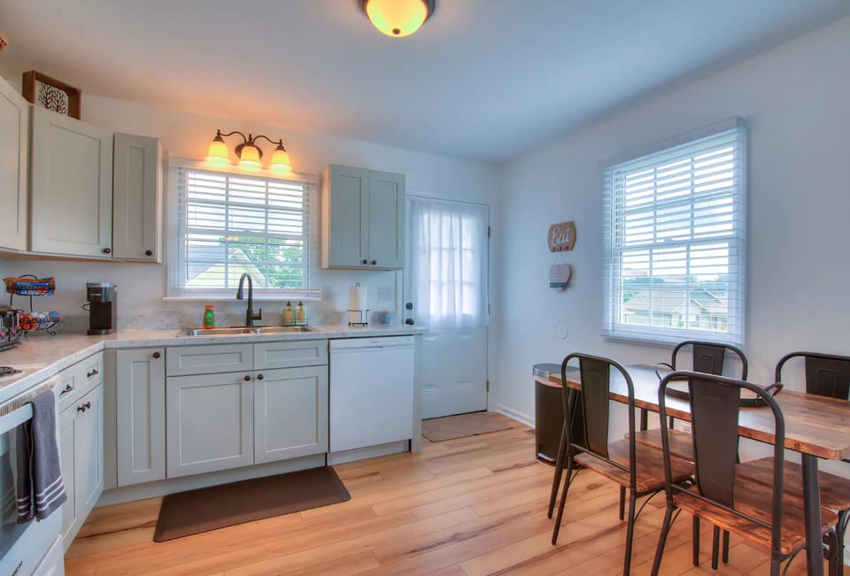 The spacious, fully equipped kitchen is ready for your cooking creativity. Make those tasty meals and serve them at the adjacent dining table.