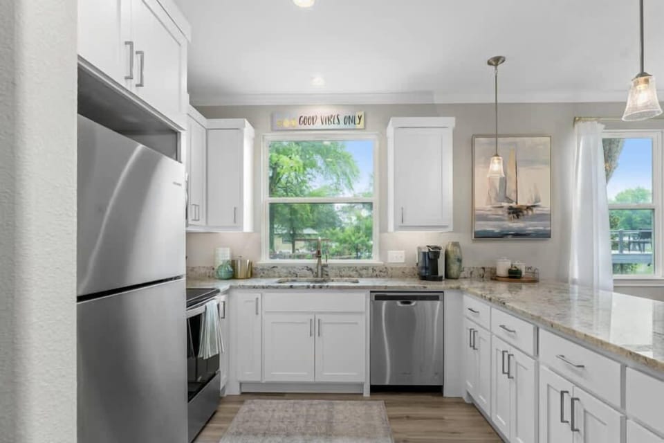Stocked kitchen with lots of counter space.