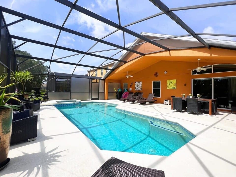 Soak up the Florida sunshine by your private pool and spa featuring sun loungers, comfortable seating, and no rear neighbors for added privacy. Optional pool heat is available for an additional fee.