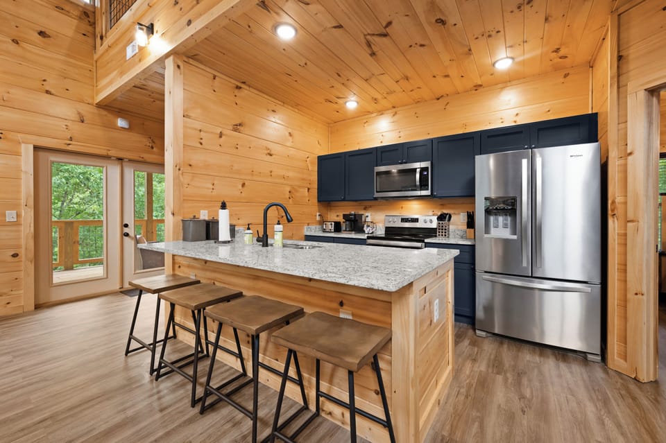 Solid surface countertops and stainless steel appliances add a touch of elegance