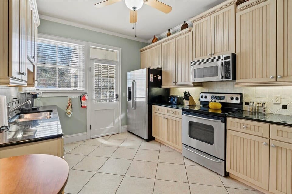 A fully-equipped kitchen with a dishwasher, coffee maker, plus a washer & dryer