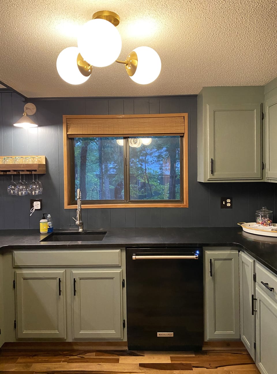 Remodeled kitchen with new granite countertops, sink and faucet.
