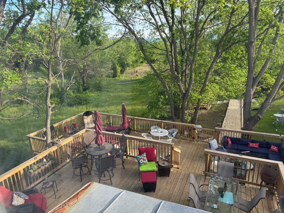 Backyard oasis! Multi level deck, gravel solar  lit walkway to fire pit/games