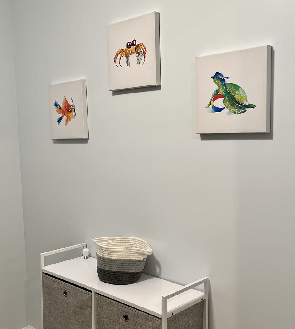 Whimsical art and storage in the bunk area