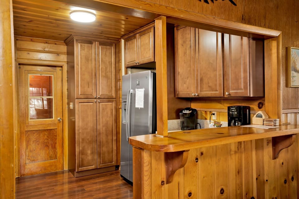 Clean and cozy cabin bathroom with a shower, sink, and toilet—simple, fresh, and comfortable for your everyday needs during a relaxing mountain stay.