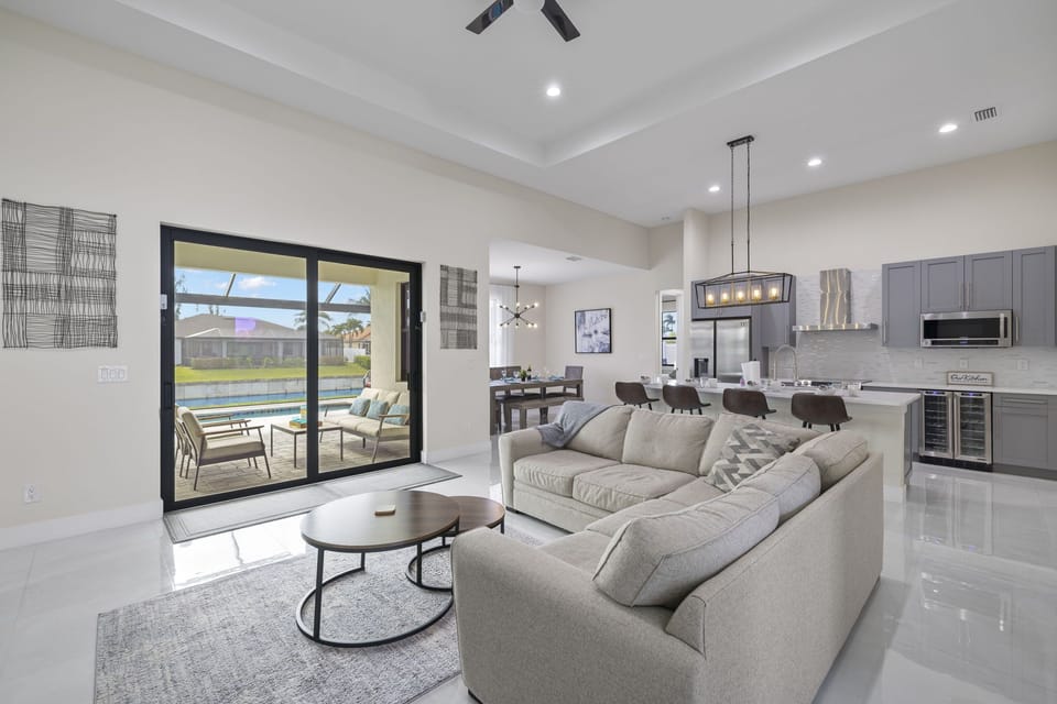 The living room has a beautiful view of the pool