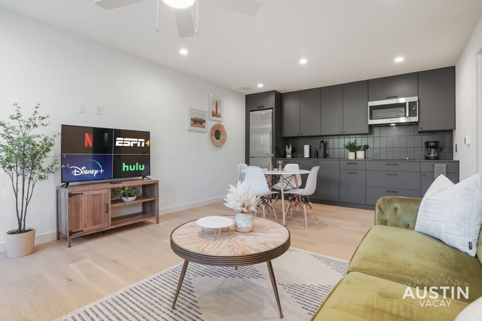 Living room with natural light, convertible sofa, and smart tv