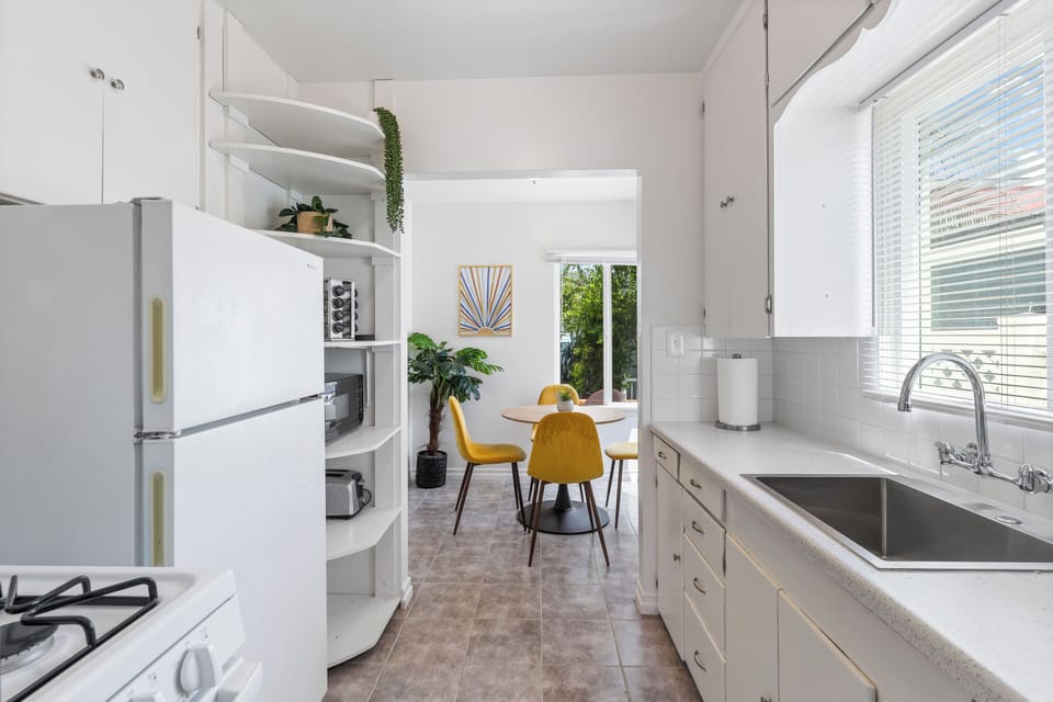 Kitchen has all the essentials to cook a good meal and serve it up. 