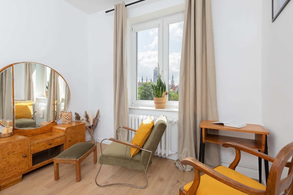 A small but functional workspace with a wooden desk and chair, ideal for remote work or study.