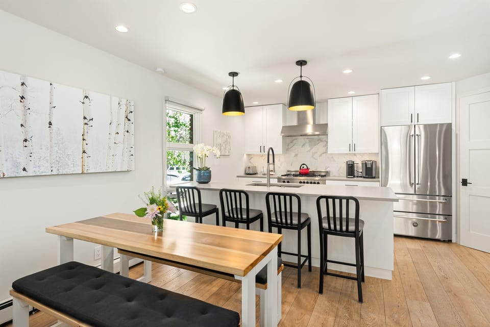 Open kitchen/living/dining area with ample seating.
