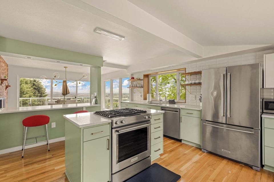 Open modern kitchen where views of the Willamette Valley are available from every spot. 