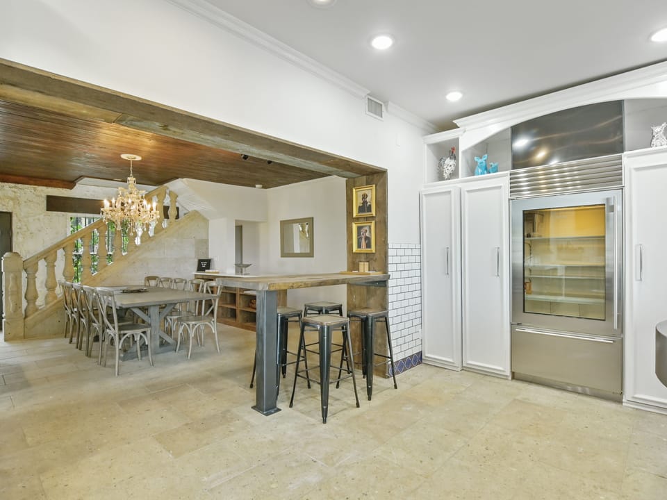 Kitchen with Bar Seating to Dining Room