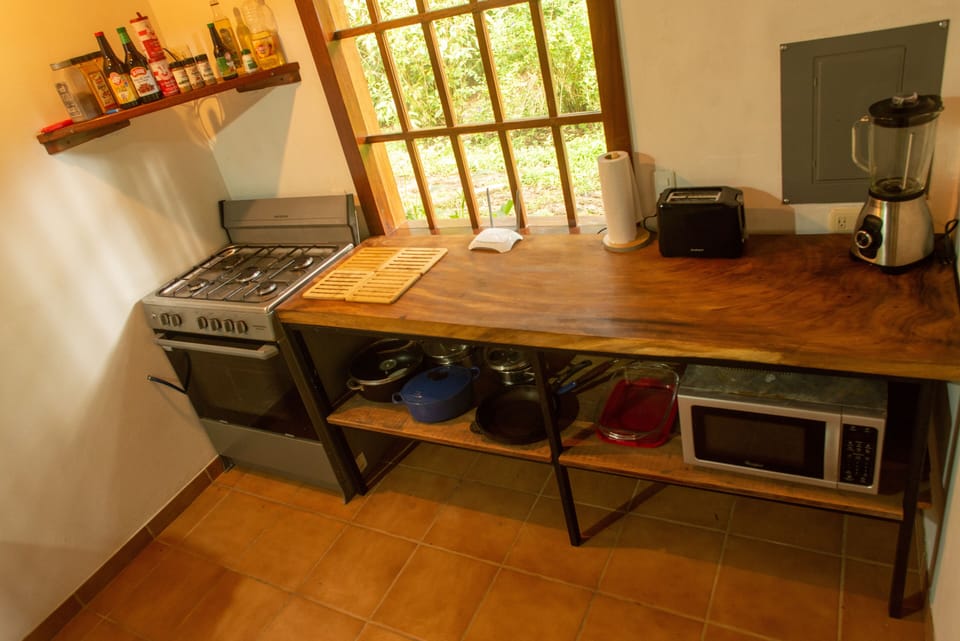 Kitchen .. cooker and hardwood side & shelves with good quality crockery