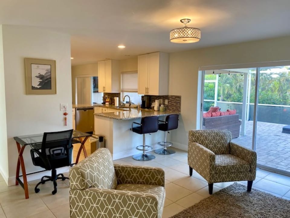 View of kitchen, sitting room and lanai in daylight