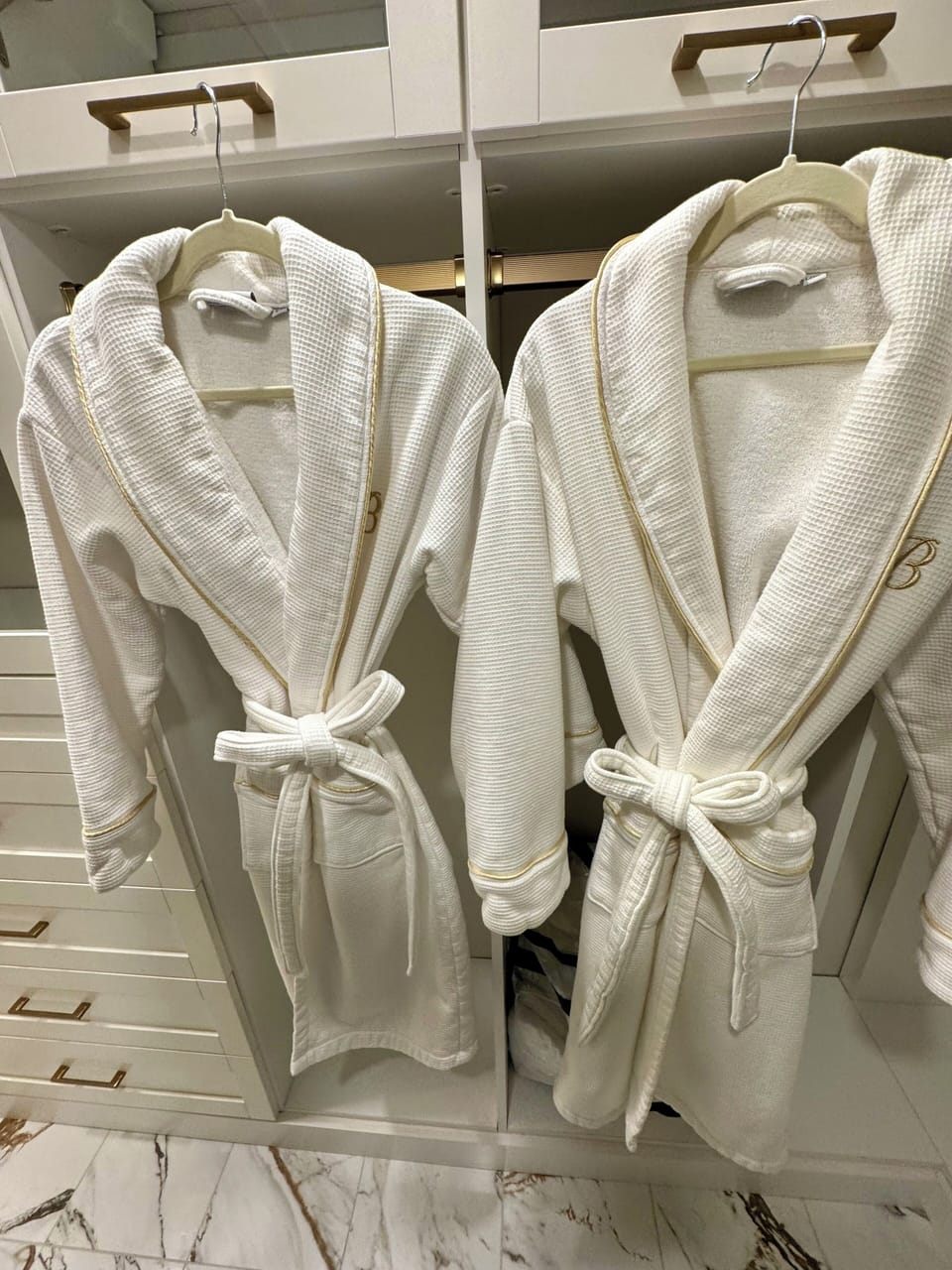Two Spa Robes for guests to use.  Located in the Primary Dressing Room / Closet