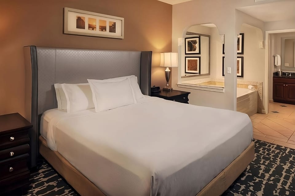 Recharge in a quiet king room with spa-style bath nearby.