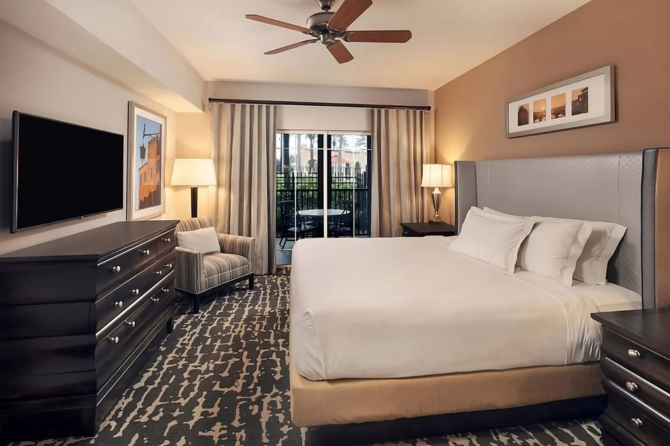 Stretch out in a serene king room with cozy seating.