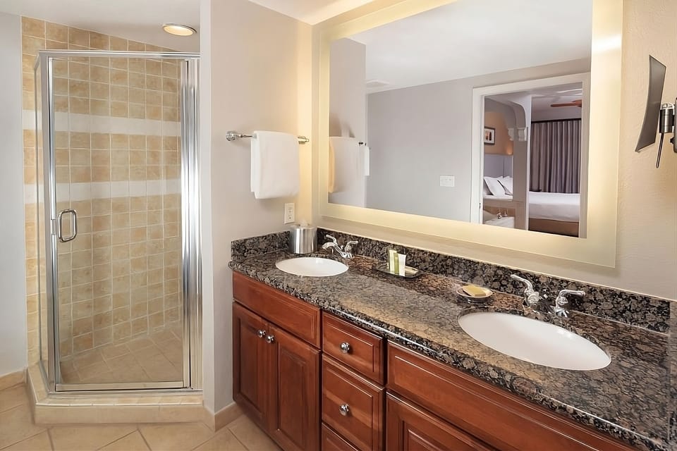 Get ready together with double sinks and glowing mirror light.