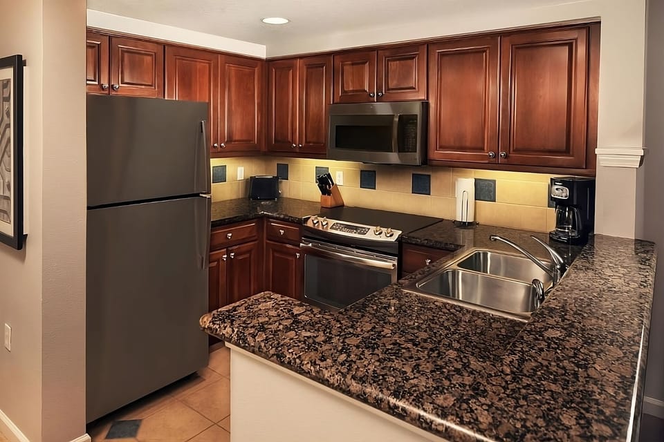 Cook with ease in a fully equipped kitchen with granite counters.