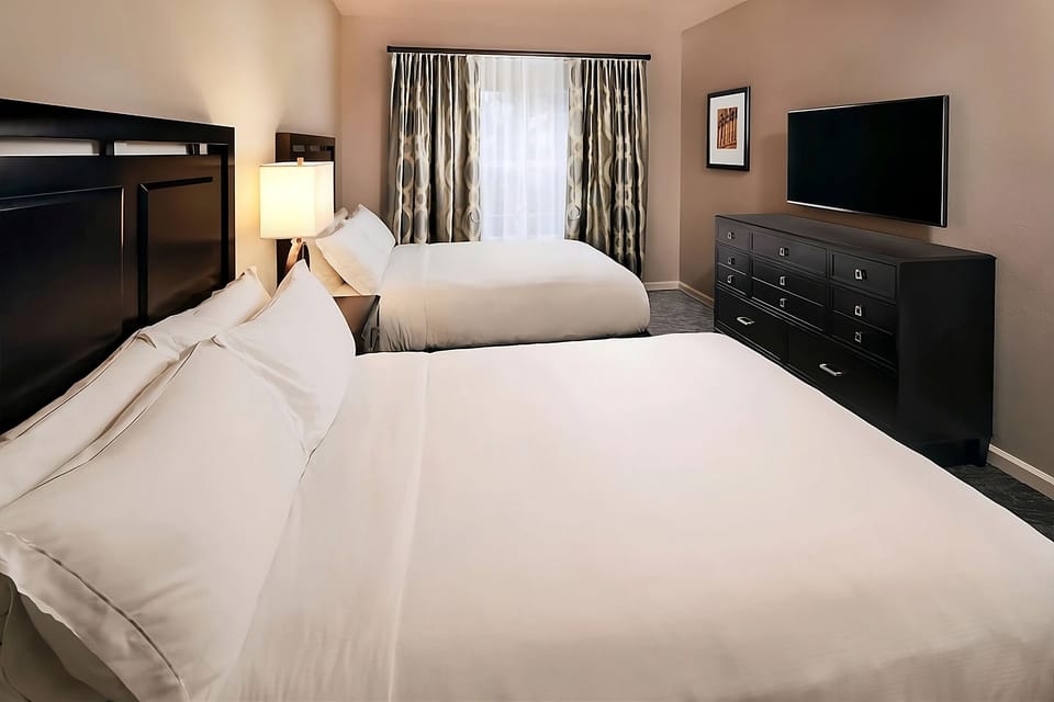 Settle the whole crew with two comfy beds and TV.