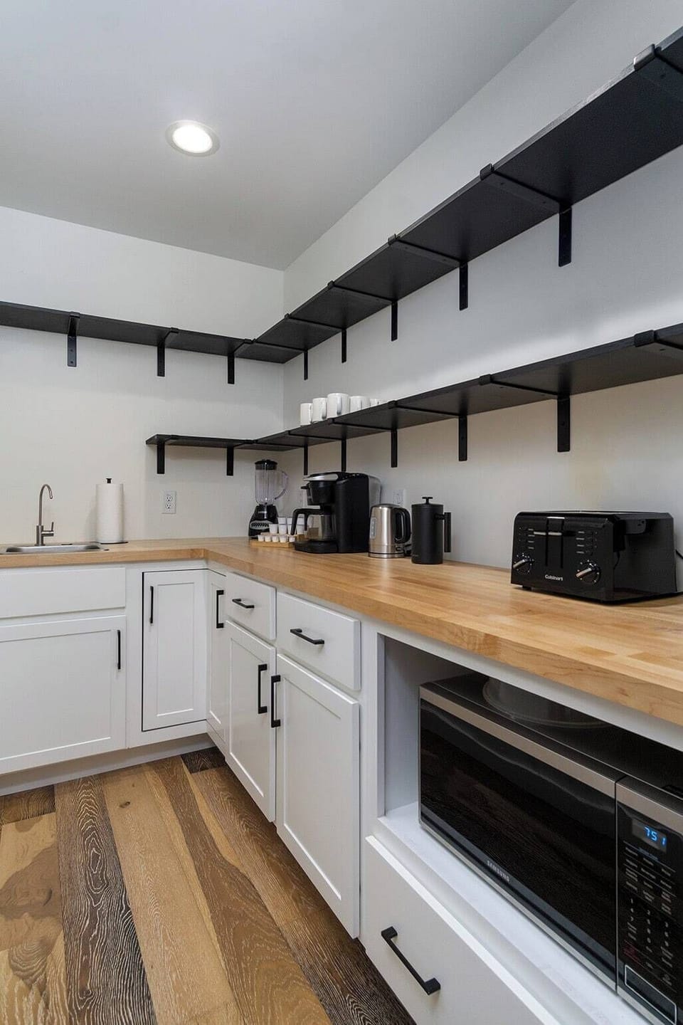 Walk in pantry (off Kitchen/Dining Area) equipped with microwave, Keurig Coffee Machine, starter K-cups/creamers, French Press, toaster, blender, popcorn machine.