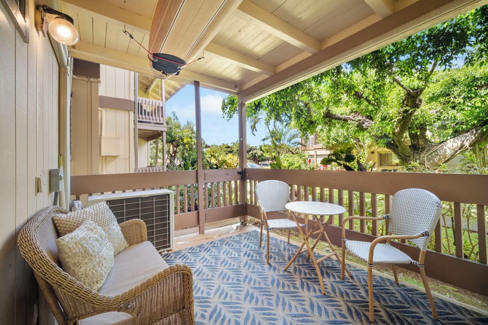 Private lanai with couch, table and chairs for relaxing after hiking all day.