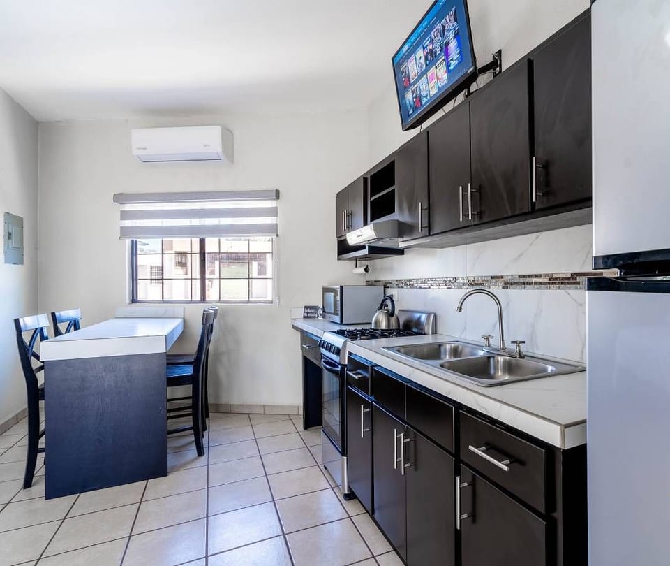 Enjoy your favorite shows on the flat screen TV in the spacious sixth bedroom of Casa Mar de Cortez, a downtown San Felipe BC rental.