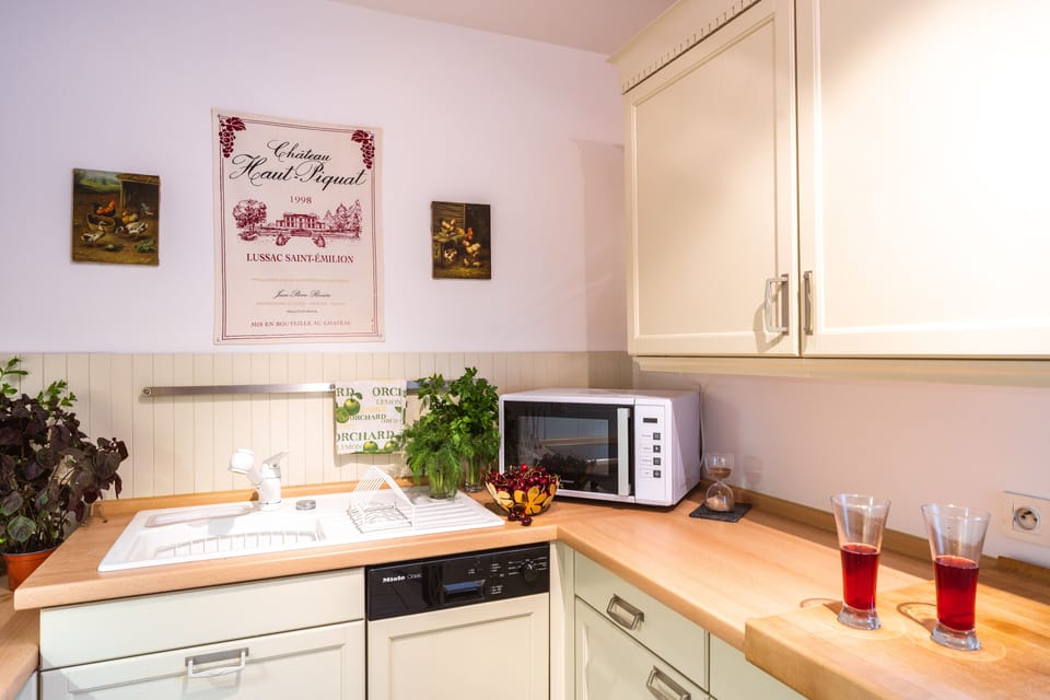 Spacious kitchen features pullout table for 2