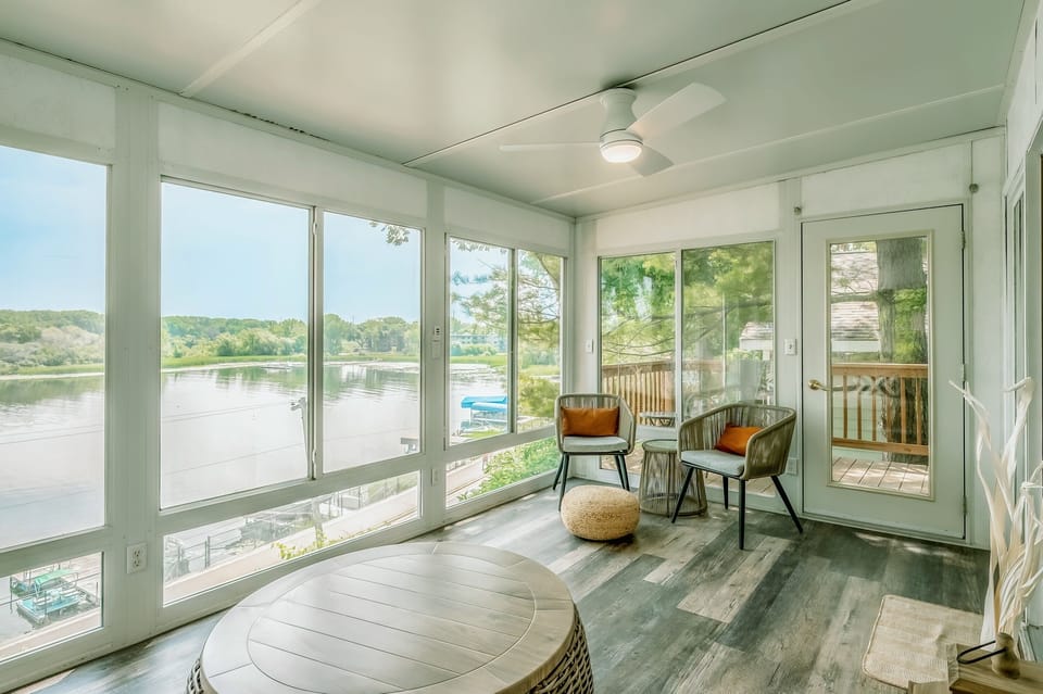 Stunning lake views from the three-season porch with upper deck attached