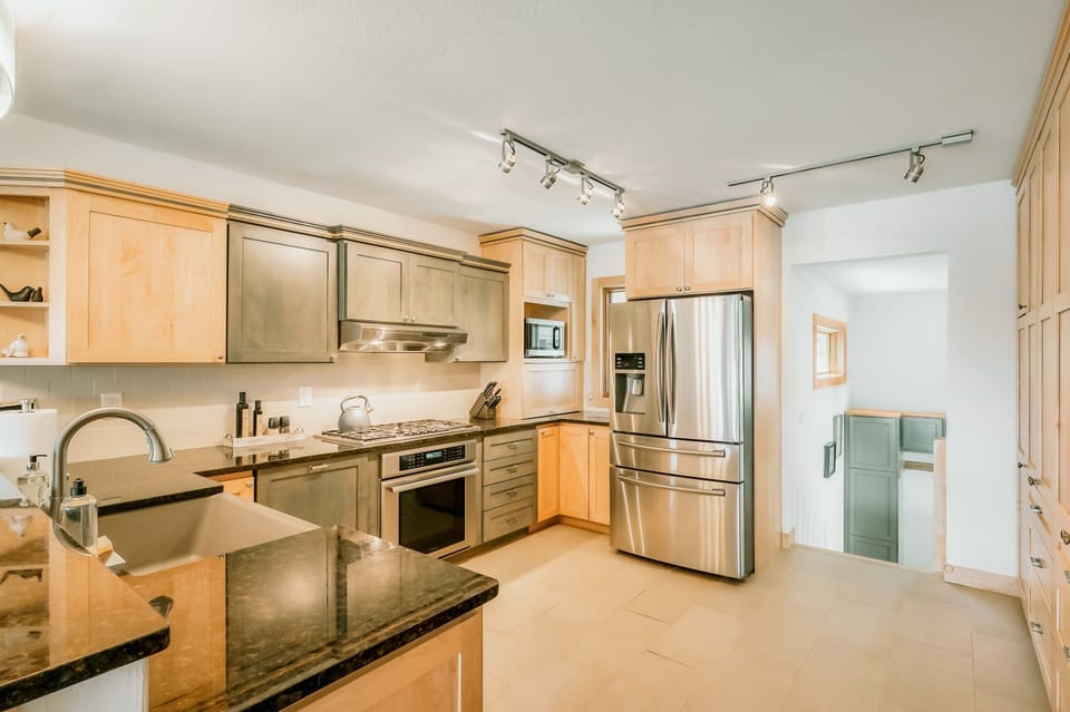 Updated Chef's Kitchen with Thermador appliances, cookware, and dinnerware